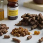 Bee propolis being examined along bone and health supplements on a lab table.